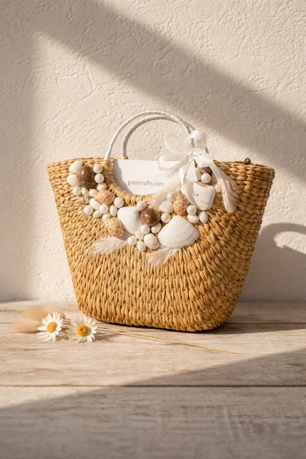 Woven handbag with decorative elements on a wooden surface with a light background. This is kauna grass handbag