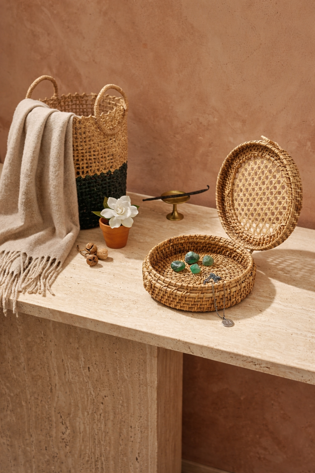 Handmade Indian artisan made cane baskets on a wooden surface with a soft pink wall background