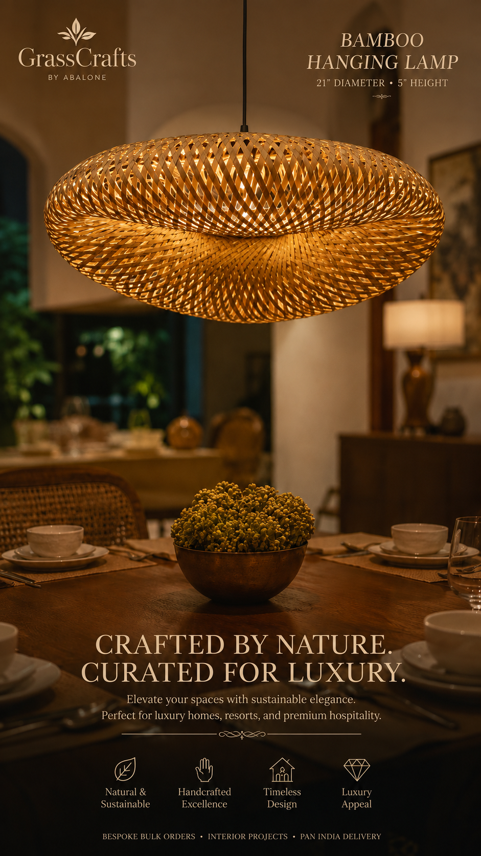 A large woven bamboo hanging lamp in a warm golden-brown tone is suspended over a dining table in a softly lit, upscale interior. The image includes branding for GrassCrafts by Aaroon and text reading 'Bamboo Hanging Lamp' and 'Crafted by Nature.