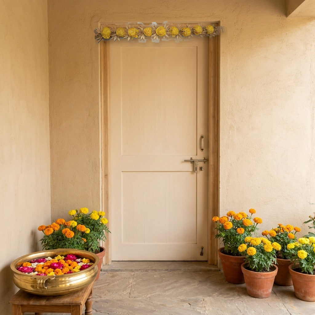Yellow rose dry flower toran above an entrance door decorated with marigolds for a haldi ceremony